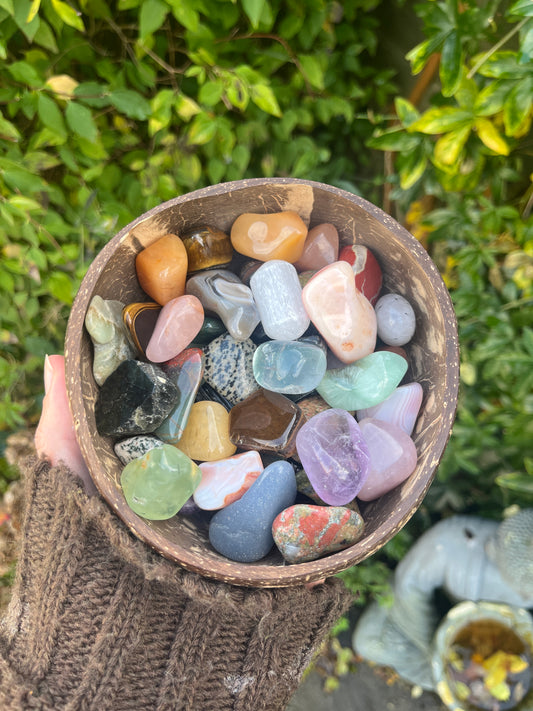 mixed variety of real gemstones in a bowl. Healing crystals, spiritual tools