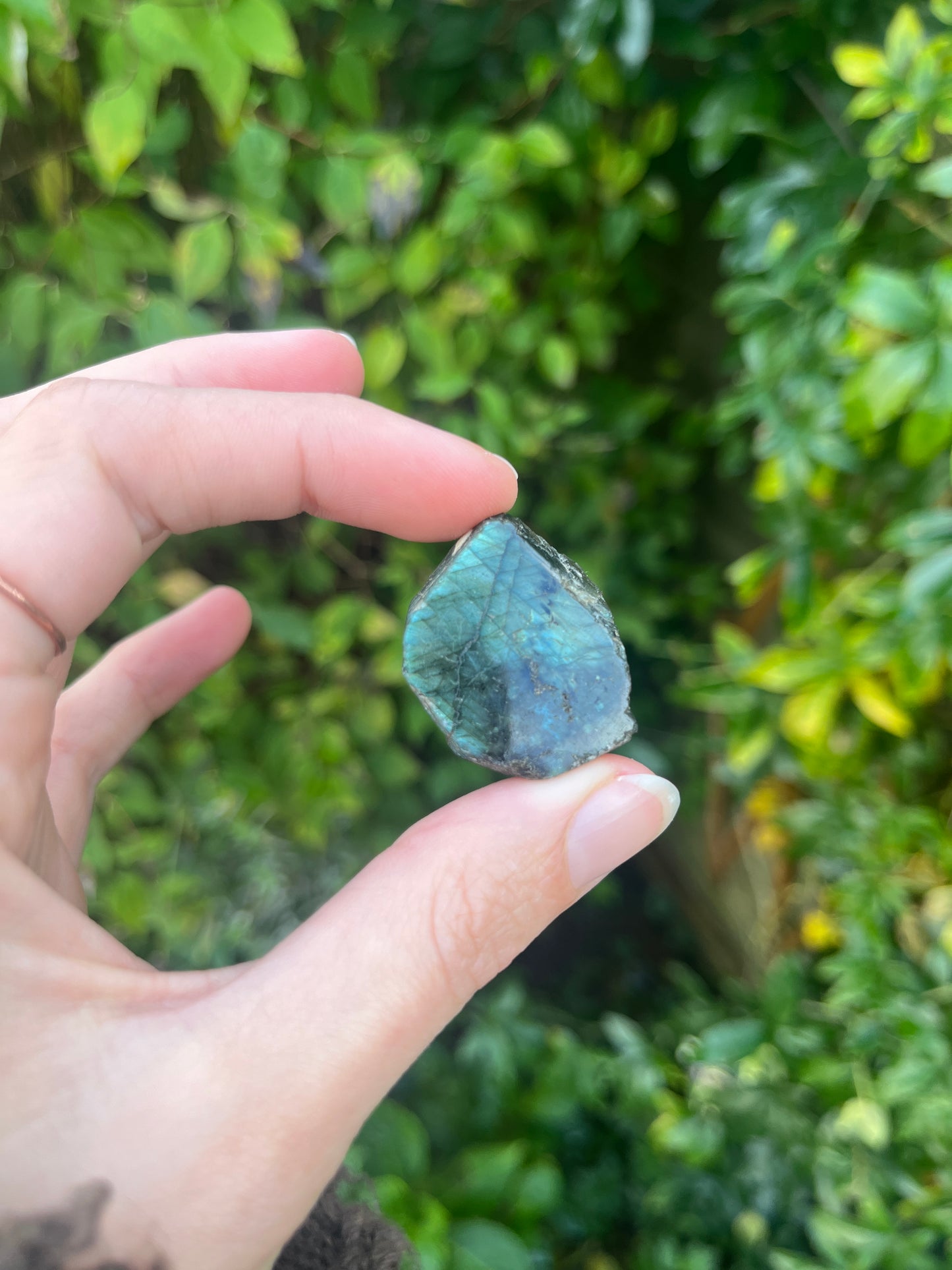labradorite crystal tumblestone in hand
